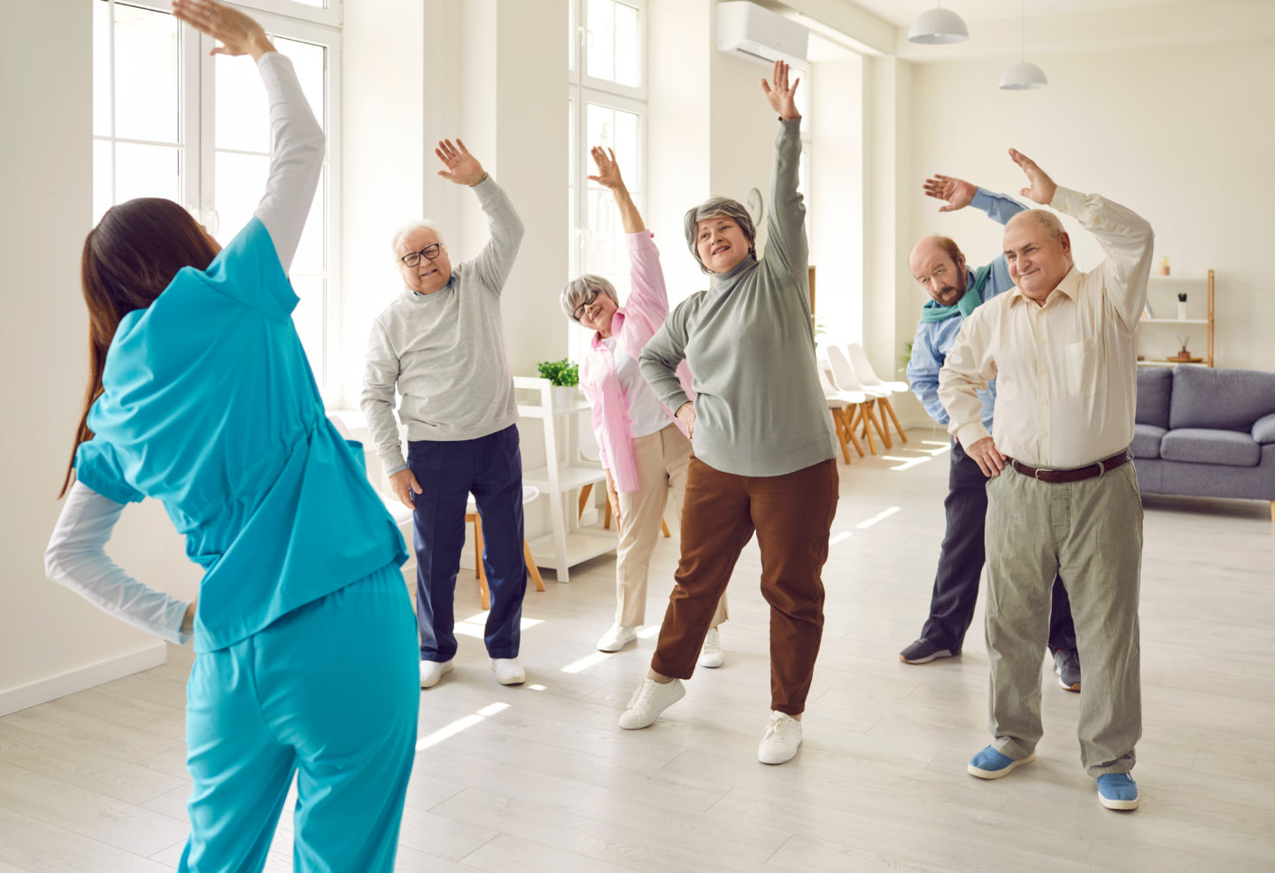 https://www.baywater.co.uk/app/uploads/Nurse-or-physiotherapist-doing-healthy-stretching-exercises-for-wellness-and-health-with-a-group-of-seniors-1440x986.jpeg